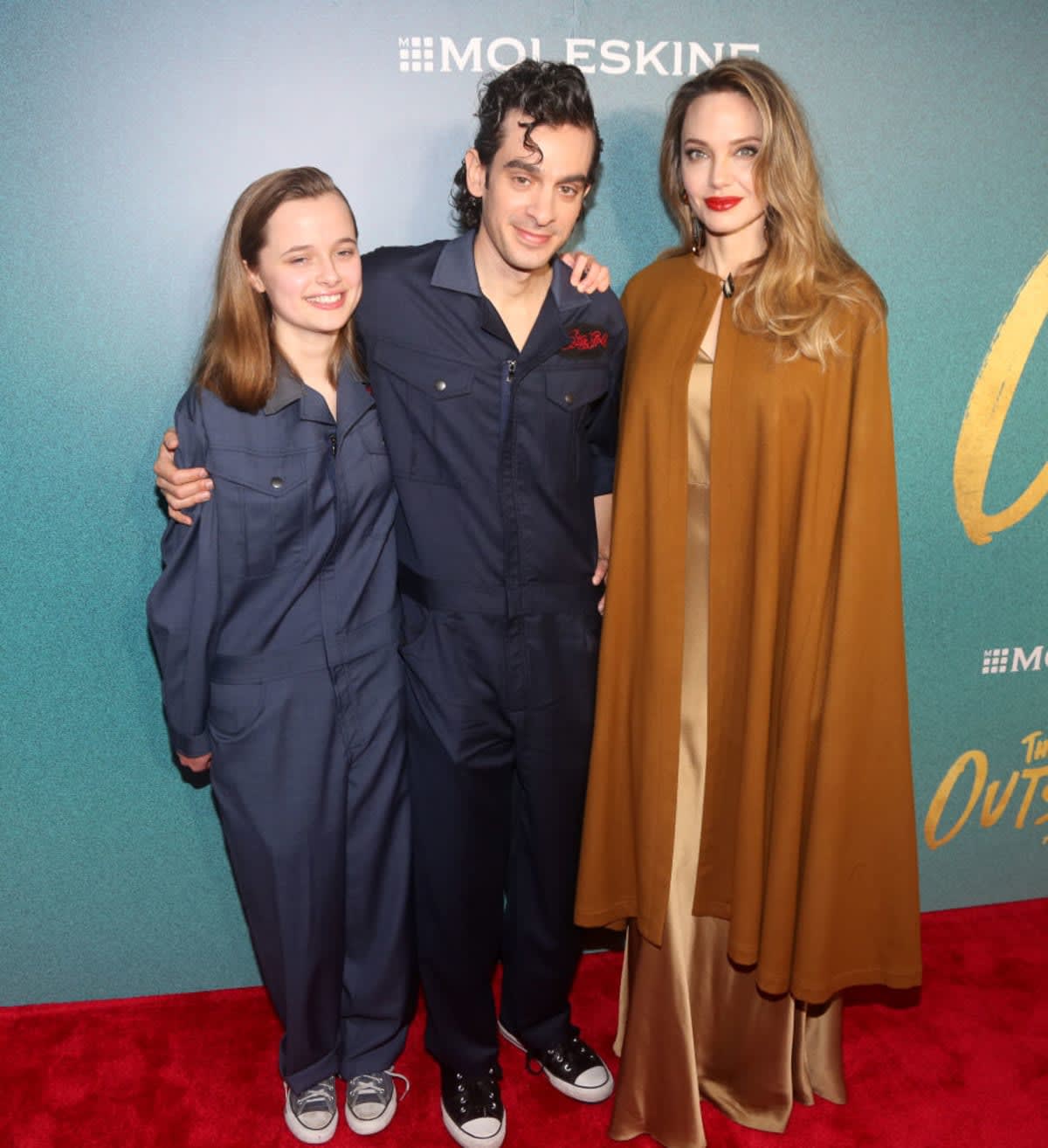 Image Source: Vivienne Jolie-Pitt, Justin Levine, and Angelina Jolie attend the opening night of 