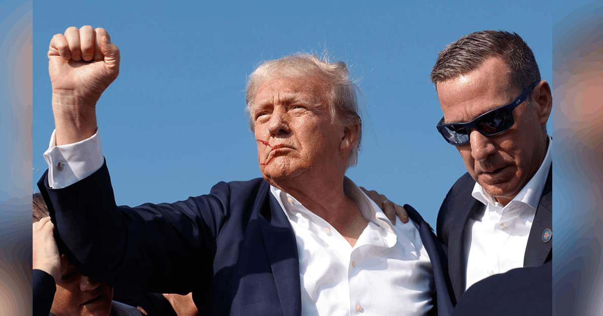 BUTLER, PENNSYLVANIA - JULY 13: Republican presidential candidate former President Donald Trump pumps his fist as he is rushed offstage by U.S. Secret Service agents after being grazed by a bullet during a rally on July 13, 2024 in Butler, Pennsylvania. (Photo by Anna Moneymaker/Getty Images)