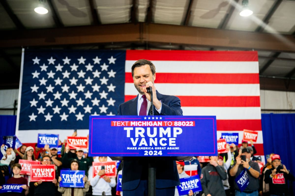 Republican vice presidential nominee J.D. Vance speaks during a campaign rally at the Elite Jet at Contact Aviation facility on October 24, 2024, in Waterford, Michigan. (Image Source: Brandon Bell/Getty Images)