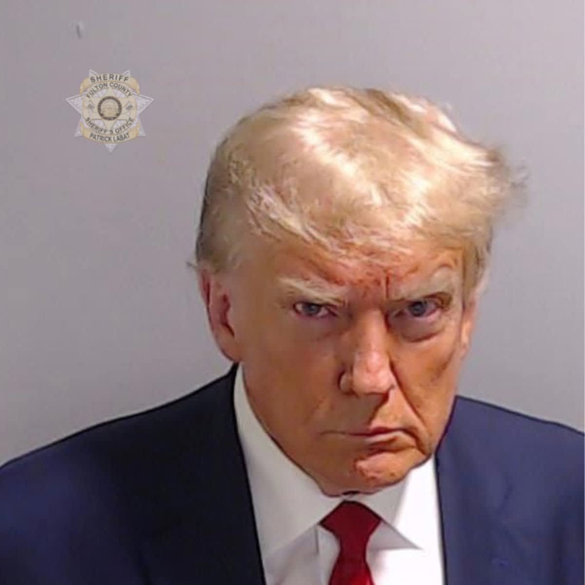 Donald Trump poses for his booking photo at the Fulton County Jail on August 24, 2023 in Atlanta, Georgia (Image Source: Getty Images / Photo by Fulton County Sheriff's Office)