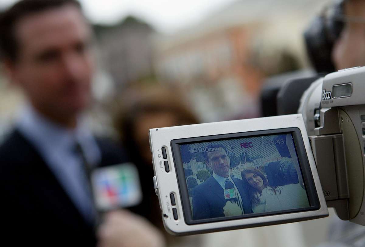 Image Source: San Francisco mayoral candidate Gavin Newsom (L) and his wife Kimberly Guilfoyle-Newsom are seen in a video camera after they cast their ballots for the mayoral run-off election December 9, 2003 in San Francisco. Newsom is facing a run-off election against green party candidate Matt Gonzalez. (Photo by Justin Sullivan/Getty Images)