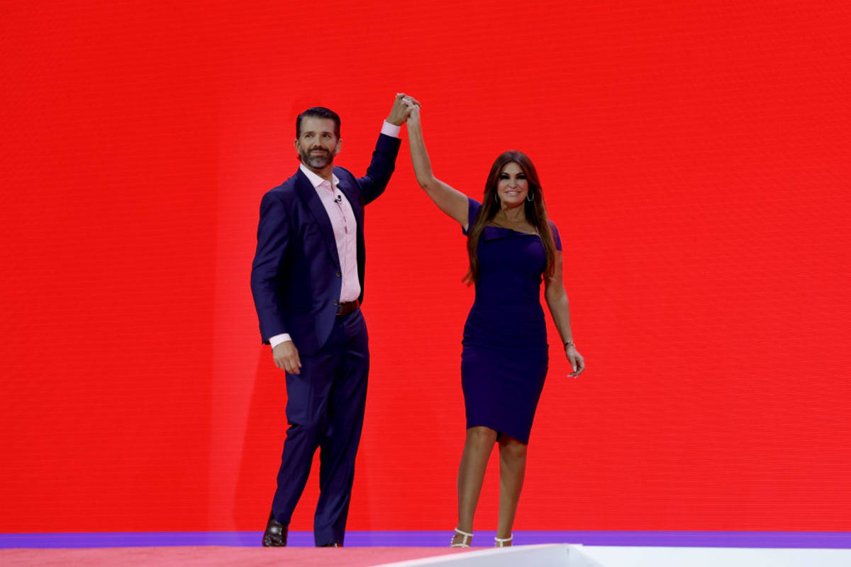 Donald Trump Jr. high-fives Kimberly Guilfoyle before speaking at the annual CPAC on March 03, 2023 in Maryland- (Image Source: Anna Moneymaker/ Getty Images)