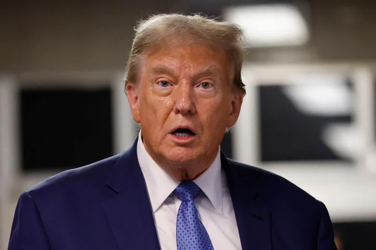 Donald Trump speaks after exiting the courtroom during his hush money trial at Manhattan Criminal Court on May 20, 2024. (Image Source: Getty Images | Photo By Michael M. Santiago)