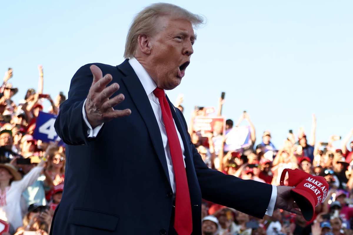 Donald Trump gestures as he walks onstage for a campaign rally on October 12, 2024, in Coachella, California. (Image Source: Mario Tama/ Getty Images)