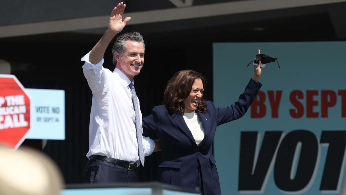 Image Source: SEPTEMBER 08: California Gov. Gavin Newsom (L) and U.S. Vice President Kamala Harris (R) greet supporters during a No on the Recall campaign event at IBEW-NECA Joint Apprenticeship Training Center on September 08, 2021 in San Leandro, California. (Photo by Justin Sullivan/Getty Images)