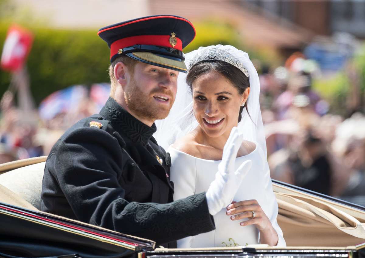 Prince Harry & Meghan ride by carriage following their wedding at St George's Chapel, Windsor Castle on May 19, 2018, in Windsor, England. Image Source: Photo by Samir Hussein | Getty Images 