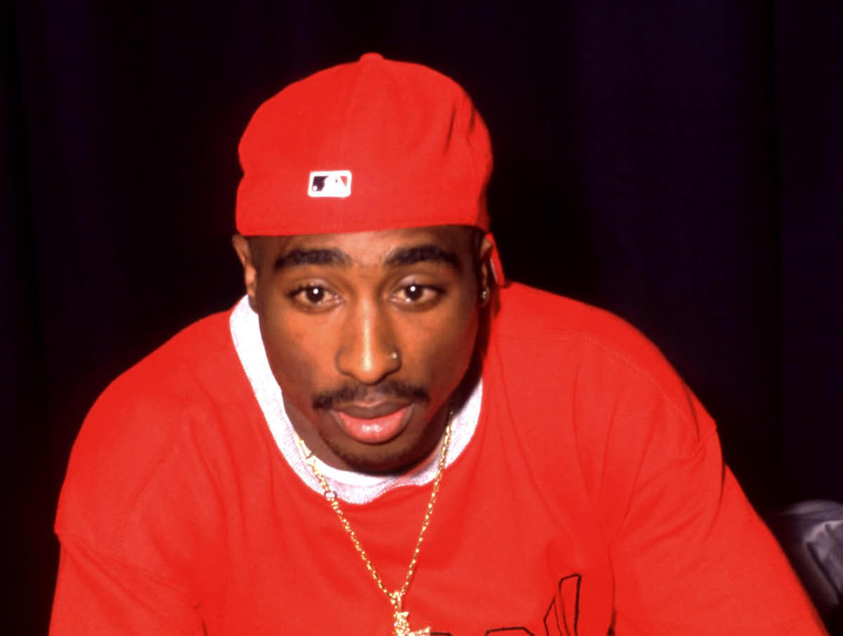 American rapper, songwriter, and actor Tupac Shakur (1971-1996), poses for a portrait during the 1994 Source Awards on April 25, 1994 at the Paramount Theatre in New York, New York. (Image Source: Bob Berg/Getty Images)