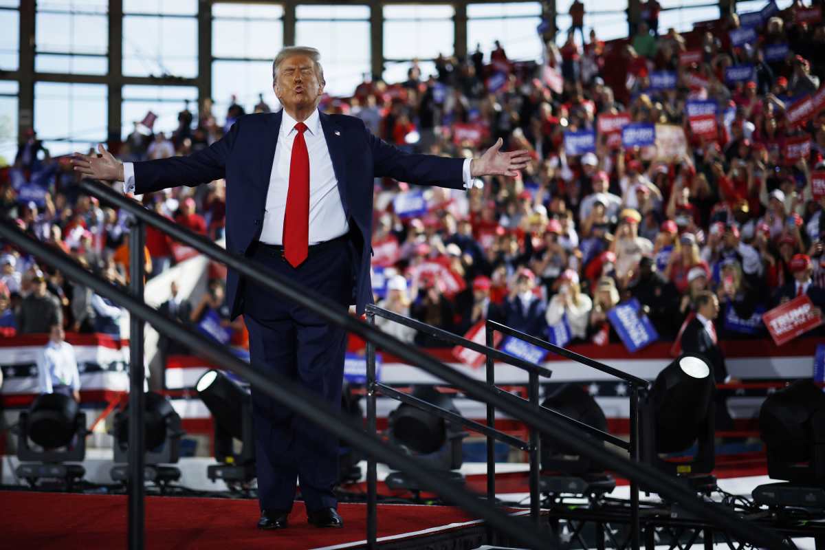 Donald Trump walks off stage at the conclusion of a campaign rally at the J.S. Dorton Arena. Image Source: Getty Images | Photo by Chip Somodevilla