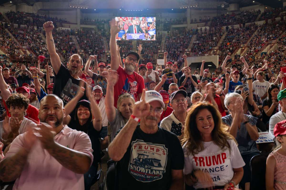 Supporters watch Republican presidential nominee, former U.S. President Donald Trump speak at a rally on July 31, 2024 in Harrisburg, Pennsylvania (Image Source: Getty Images / Photo by Spencer Platt)