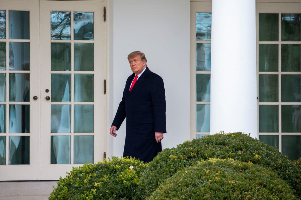 U.S. President Donald Trump walks to the Oval Office while arriving back at the White House on December 31, 2020, in Washington, DC. (Cover Image Source: Tasos Katopodis/Getty Images)