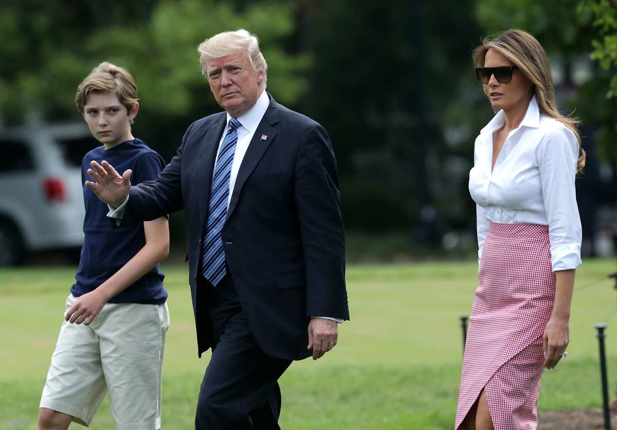 Donald, Melania, and son Barron Trump walk on the South Lawn prior to a Marine One departure at the White House on June 30, 2017, in Washington, DC. (Image Source: Alex Wong/Getty Images)