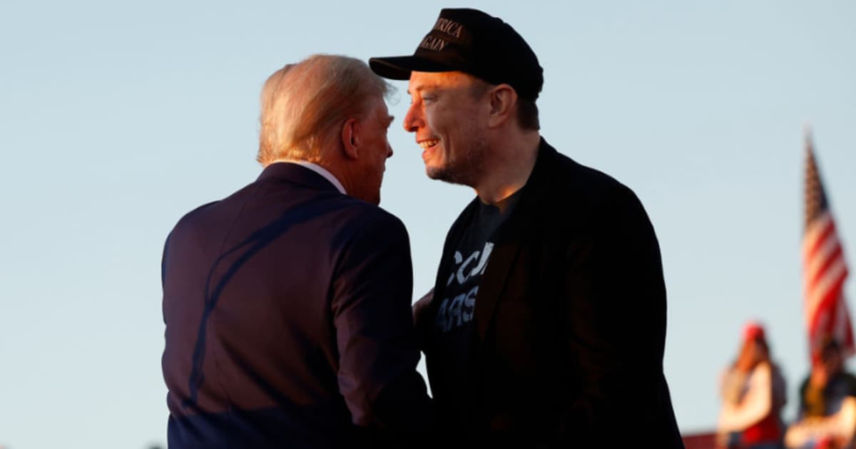 Elon Musk embraces Donald Trump during a campaign rally on October 05, 2024 in Butler, Pennsylvania. (Image Source: Getty Images | Photo By Anna Moneymaker)