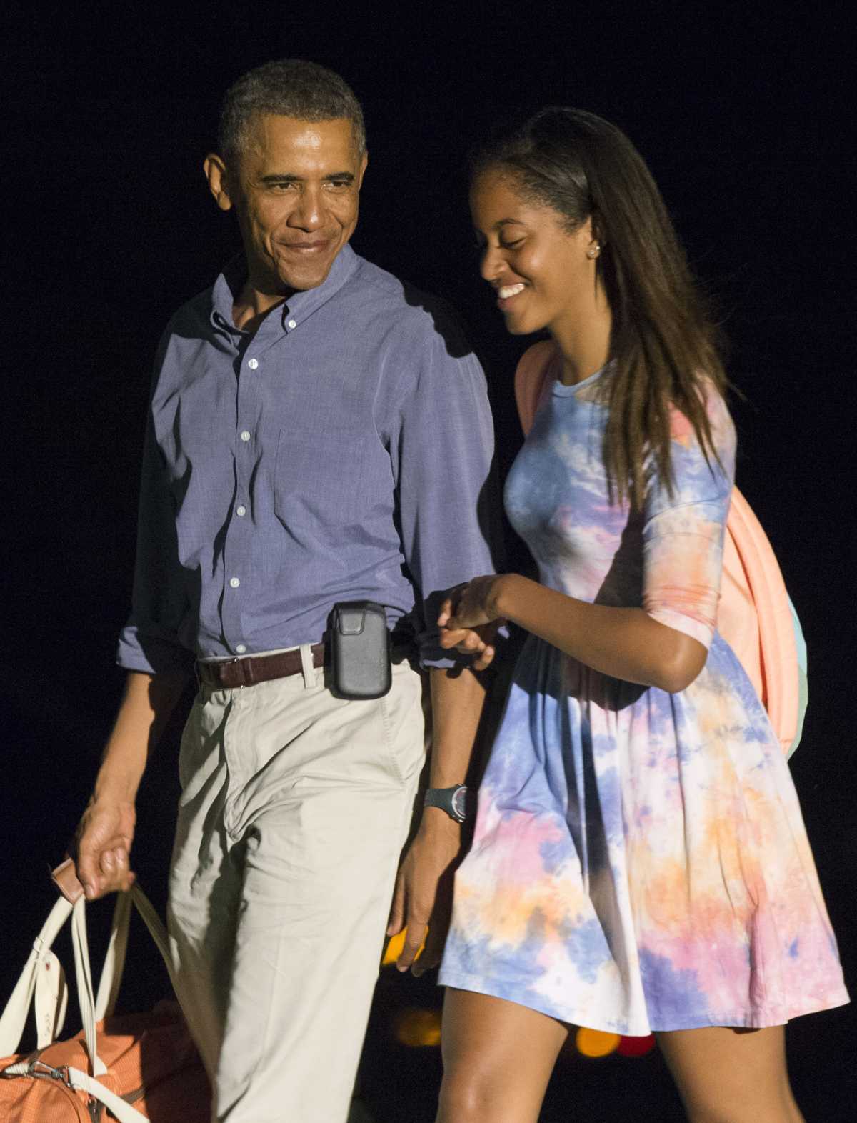 President Barack Obama and his elder daughter Malia returned to the White House on August 17, 2014, in Washington, DC. (Image Source: Getty Images | Photo by Kevin Dietsch-Pool)