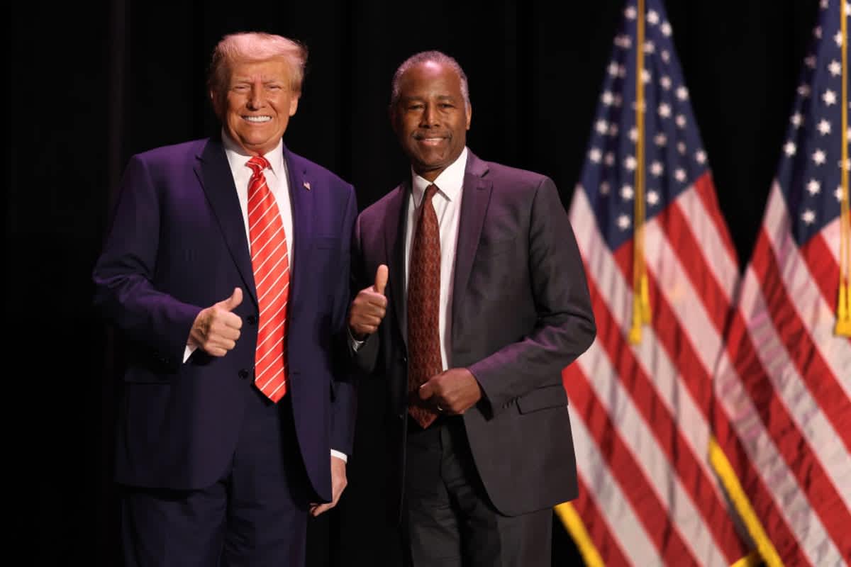 Donald Trump greets former HUD Secretary Ben Carson at a campaign on October 29, 2023, in Sioux City, Iowa. (Image source: Getty Images| Photo by Scott Olson) 