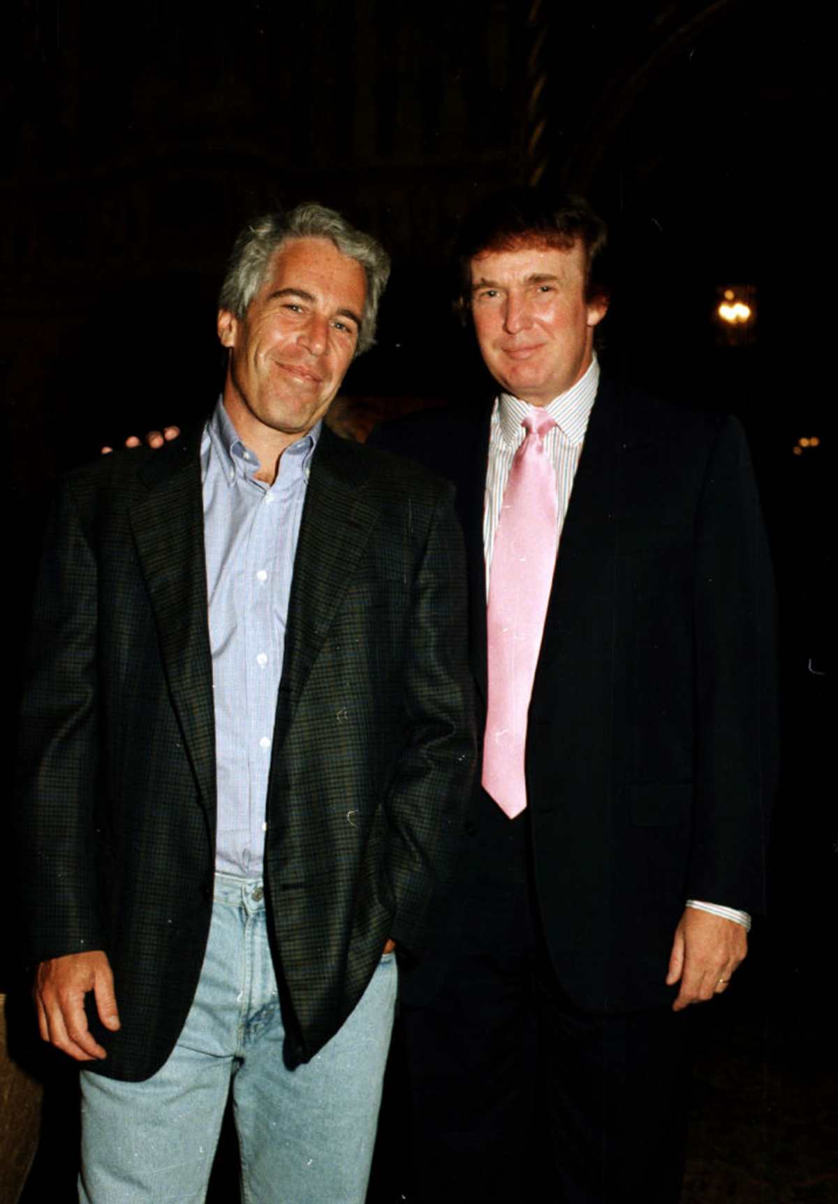 Jeffrey Epstein and real estate developer Donald Trump as they pose together at the Mar-a-Lago estate, Palm Beach, Florida, in 1997. (Image Source: Getty Images | Photo by Davidoff Studios)