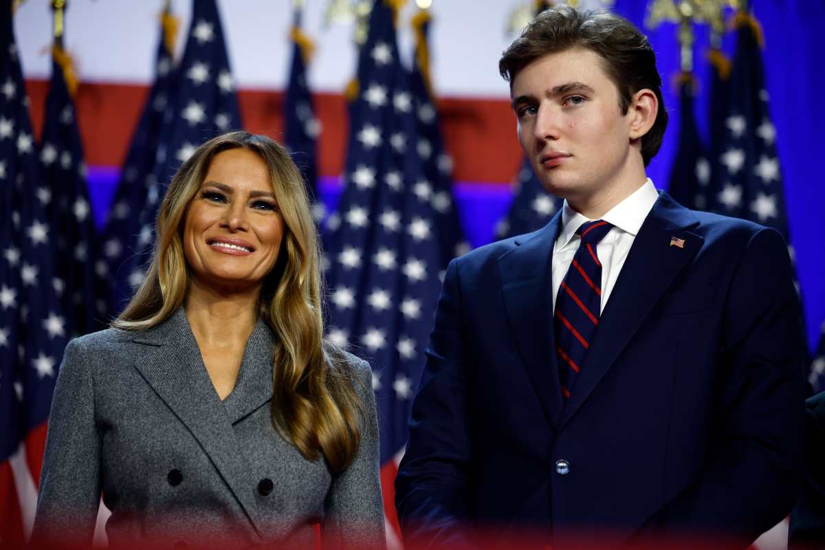 Melania Trump and Barron Trump look on as Donald Trump speaks during an election night event. (Image Source): Getty Images | Photo by Chip Somodevilla