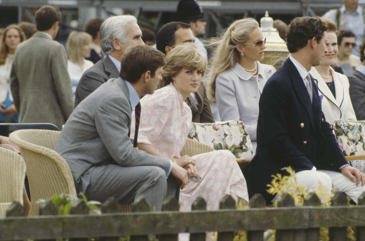 Lady Diana Spencer and Prince Charles attend the Cartier International polo match on Smith's Lawn, Windsor, days before their wedding, in July 1981; on the left is Charles's brother, Prince Andrew. (Image Source: Getty Images | Photo by Jayne Fincher)