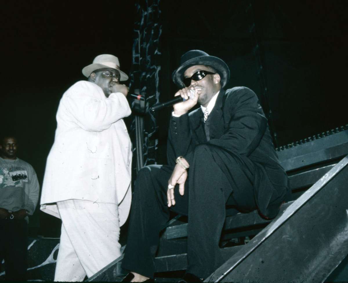 American rappers Notorious BIG and Sean Combs perform onstage, Anaheim California, circa 1994. (Image Source: Getty Images | Photo by Nitro)