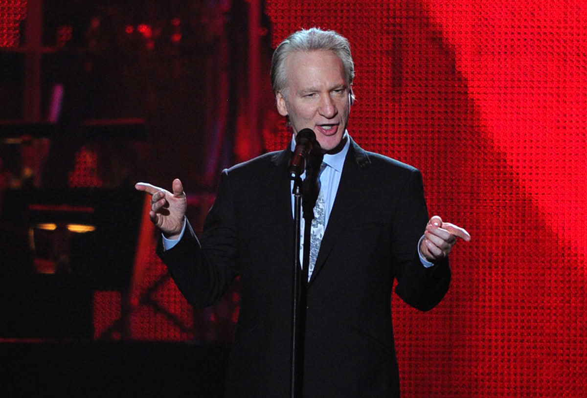 Comedian Bill Maher speaks onstage at the 2011 MusiCares Person of the Year Tribute. (Image Source: Photo by Alberto E. Rodriguez/Getty Images)