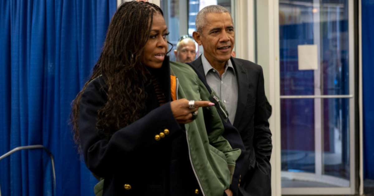 Michelle Obama and Barack Obama arrive to cast their vote at an early voting venue on October 17, 2022, in Chicago, Illinois.(Image Source: Getty Images | Photo By Jim Vondruska)