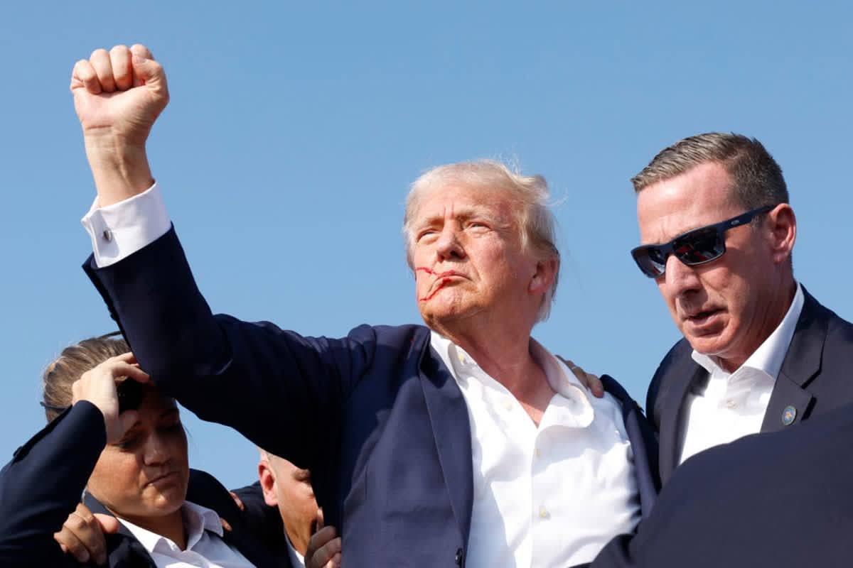 President Donald Trump is rushed offstage during a rally on July 13, 2024 in Butler, Pennsylvania.  (Image Source:  Anna Moneymaker/Getty Images)