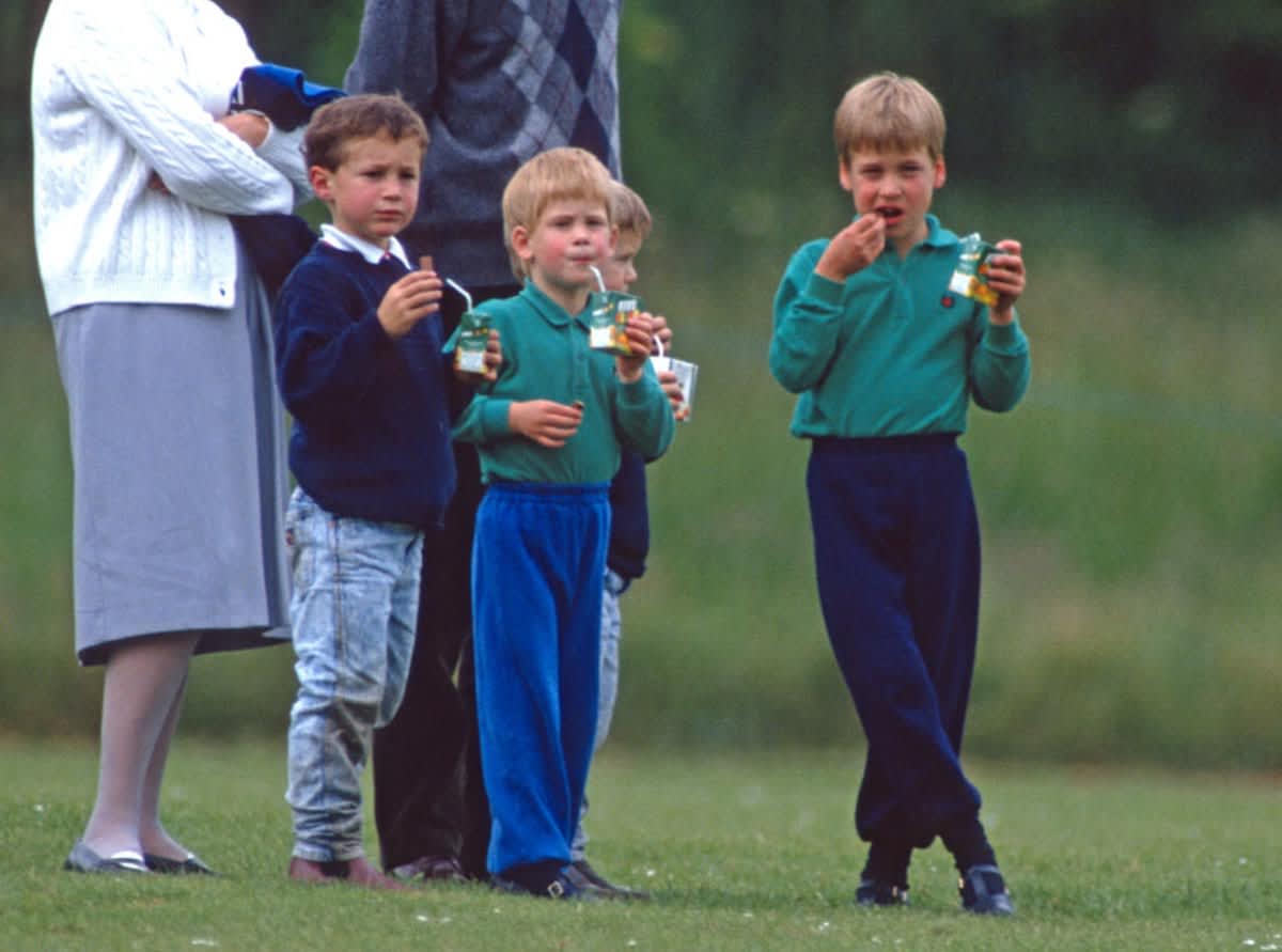 Prince William & Prince Harry having snacks at a polo match at Cirencester Park on June 15, 1989, in England. (Image Source: Getty Images| Photo by Anwar Hussein)