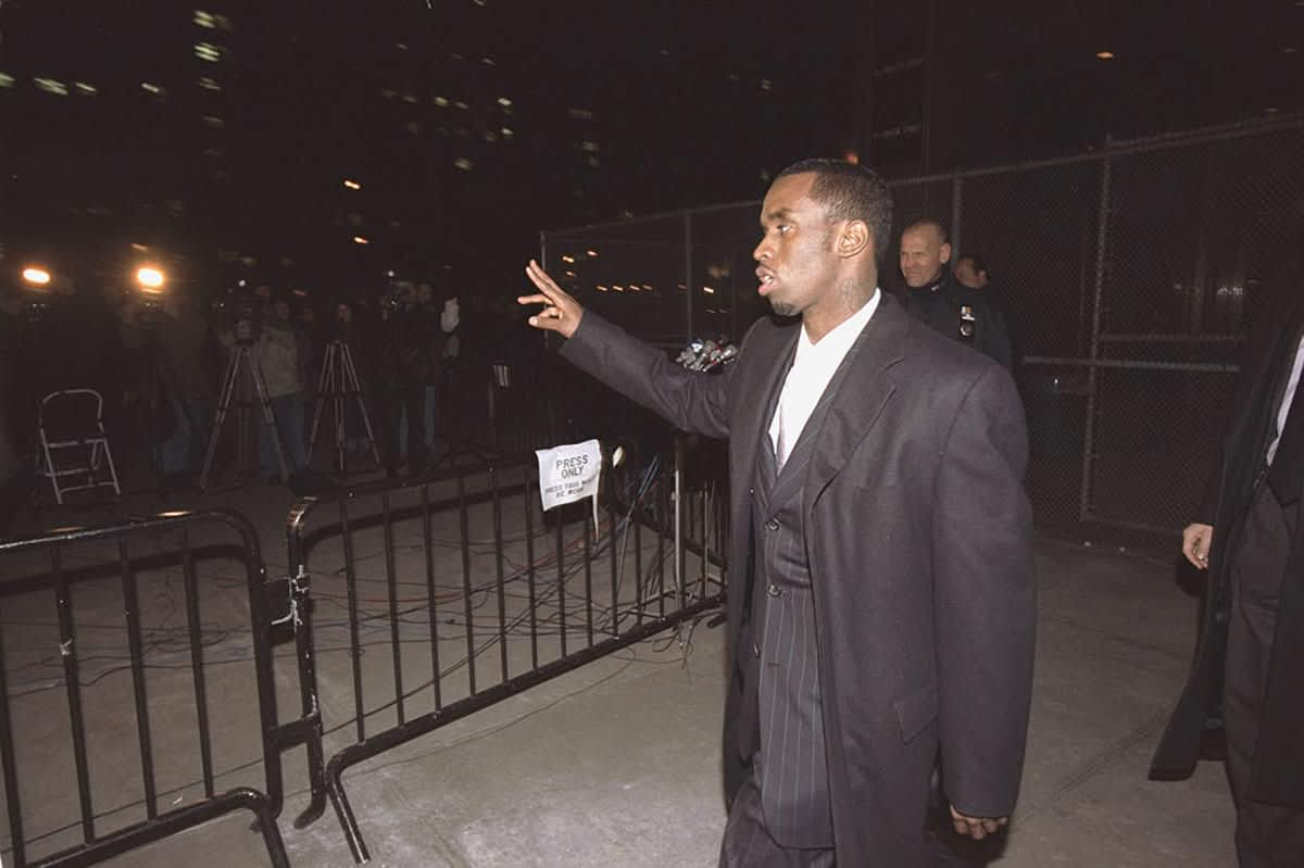 Sean 'Puffy' Combs leaves court for the first day of his trial, Monday, January 29, 2001, in New York. (Image Source: Getty Images| Photo by Keith D. Bedford) 