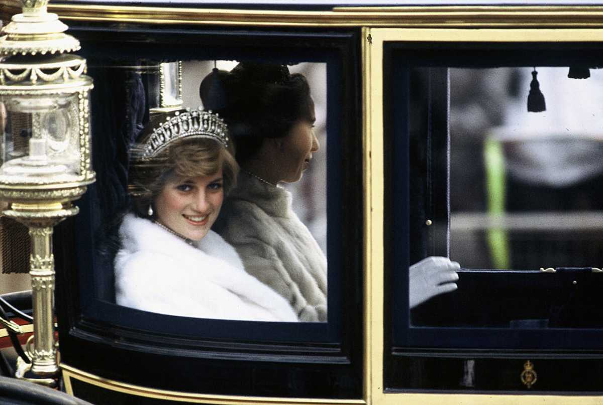 Princess Diana, Princess of Wales, on her way to the State Opening of Parliament in November 1981. She is travelling in the Glass Coach used for her wedding. (Image Source: Anwar Hussein/Getty Images)