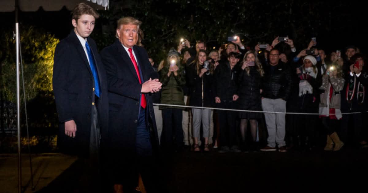 Donald Trump and Barron Trump leave the White House on December 20, 2019, in DC.  (Image Source: Getty Images | Photo By Zach Gibson)