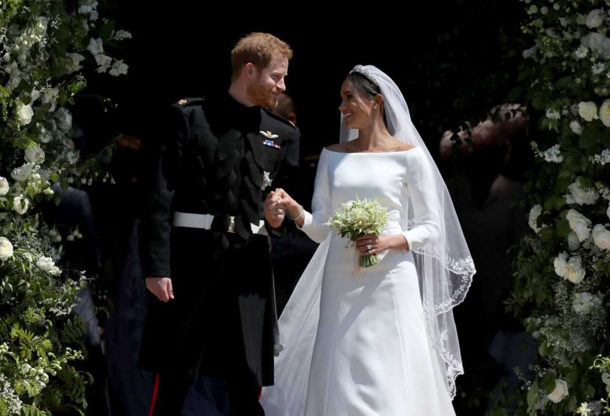 Prince Harry, Duke of Sussex, and The Duchess of Sussex share a kiss after their wedding at St George's Chapel at Windsor Castle on May 19, 2018 in Windsor, England. (Image Source: Getty Images | Photo by Jane Barlow)