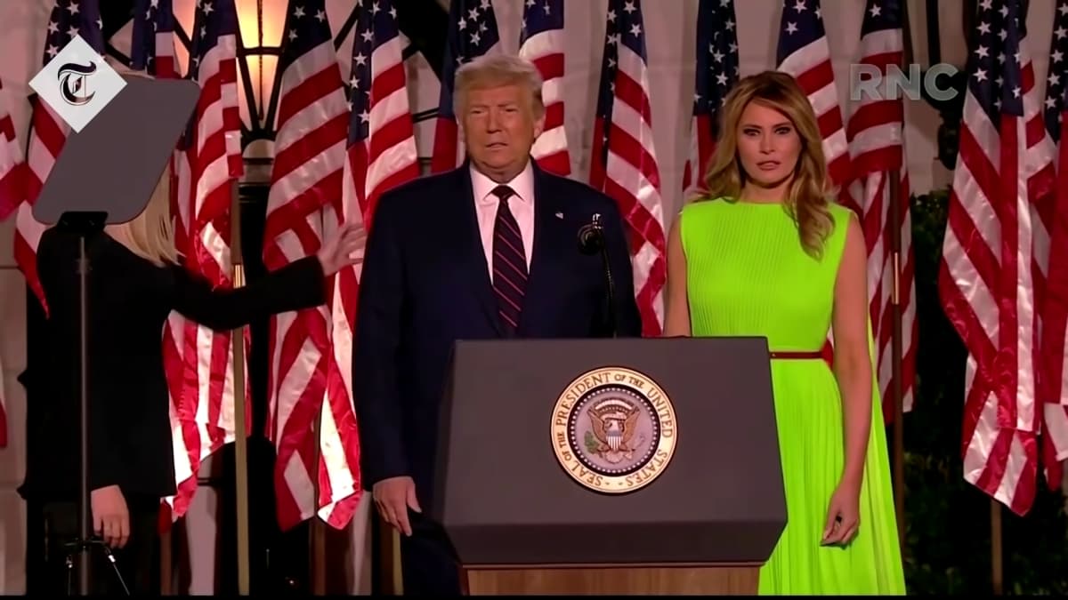 First Lady Melania Trump onstage with then-incumbent President Donald Trump. (Image Source: YouTube | The Telegraph)