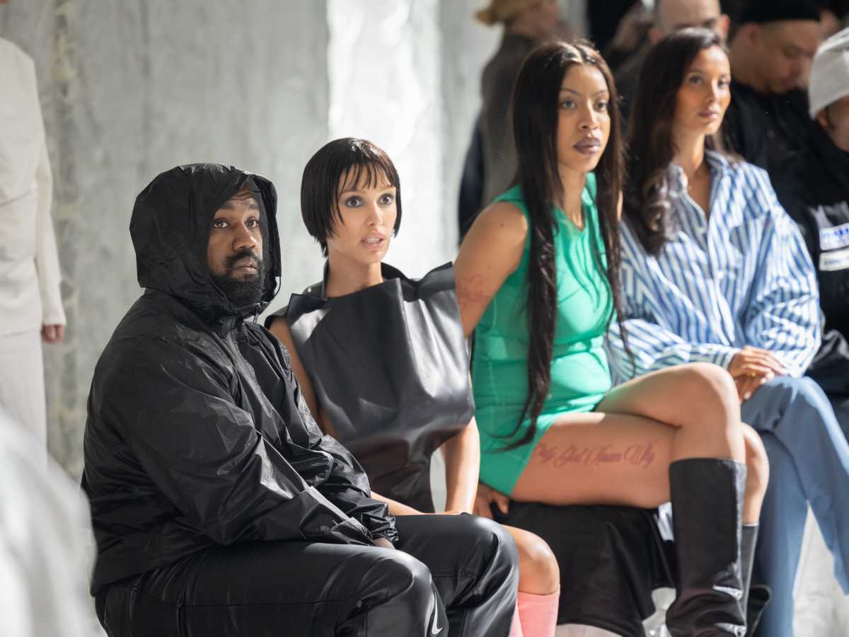 Kanye West and Bianca Censori attend the Marni fashion show on February 23, 2024, in Milan, Italy. (Image Source: Getty Images | Photo by Arnold Jerocki)