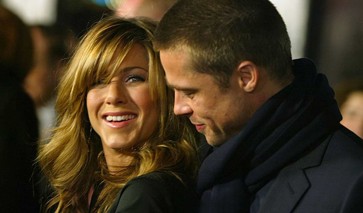 Actress Jennifer Aniston and actor Brad Pitt attend the Los Angeles premiere of the film 'Along Came Polly' at the Grauman's on January 12, 2004, in Hollywood. (Image Source: Getty Images | Photo by Kevin Winter)