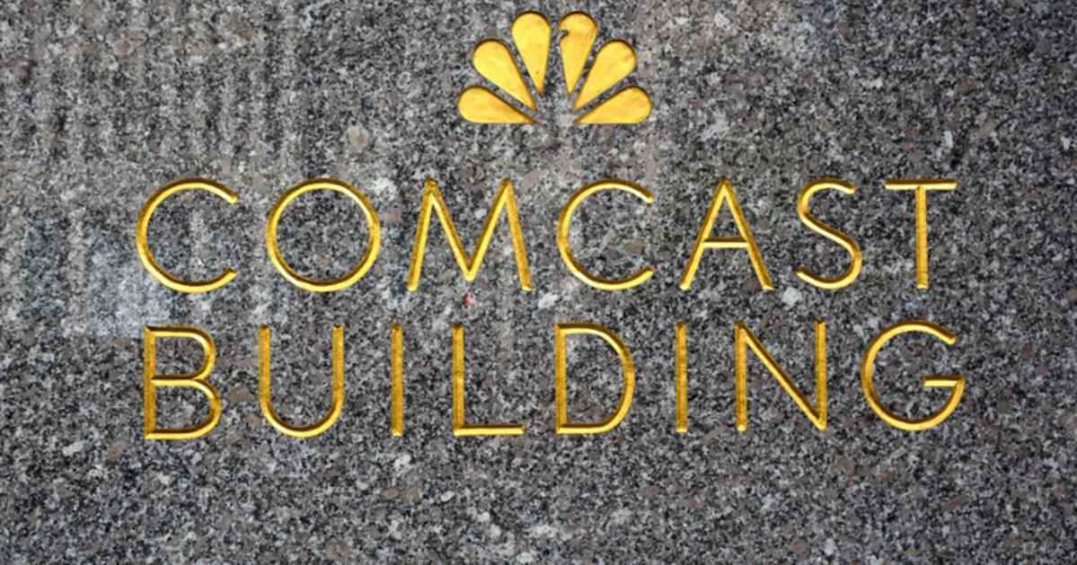 The NBC-TV network peacock logo embellishes a granite wall near the entrance to the Comcast Building in New York, (Image Source: Getty Images | Photo By Robert Alexander)