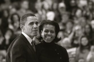 Barack and Michelle Obama Exit the Stage. Des Moines, Iowa, United States, January 7, 2008. Uploaded on January 7, 2008/ via Flickr