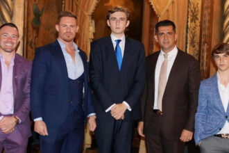 Barron Trump (C) with Valuetainment podcast host Patrick Bet-David (to Barron's right) and other guests at Mar-a-Lago