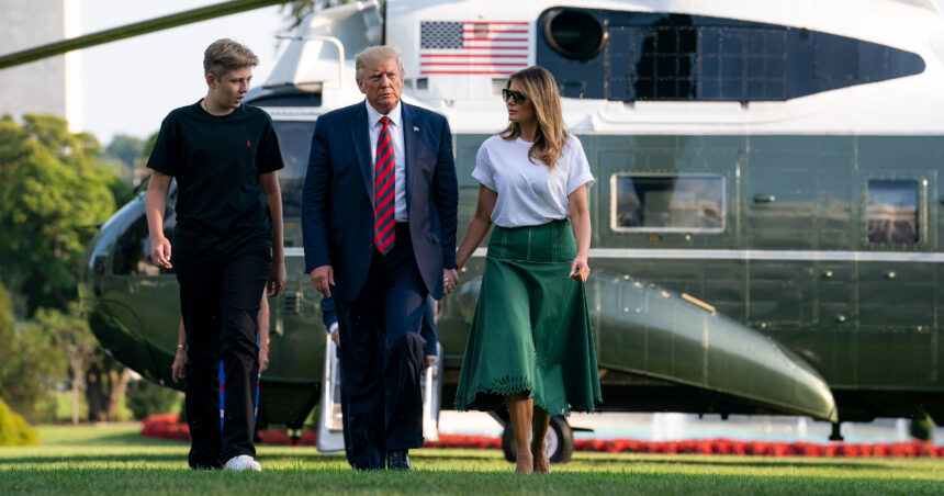 Donald J. Trump, Melania Trump, and their son, Barron, walk across the South Lawn of the White House